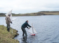 Stephen, Douglas (behind Stephen) and Johnny launch the boats for the practice race. Photo: RC